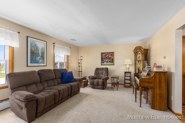 living room with visible vents, carpet floors, baseboards, and a wealth of natural light