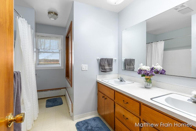 full bath featuring baseboard heating, visible vents, a sink, and double vanity