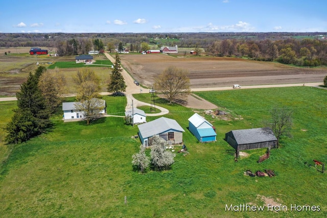 birds eye view of property featuring a rural view