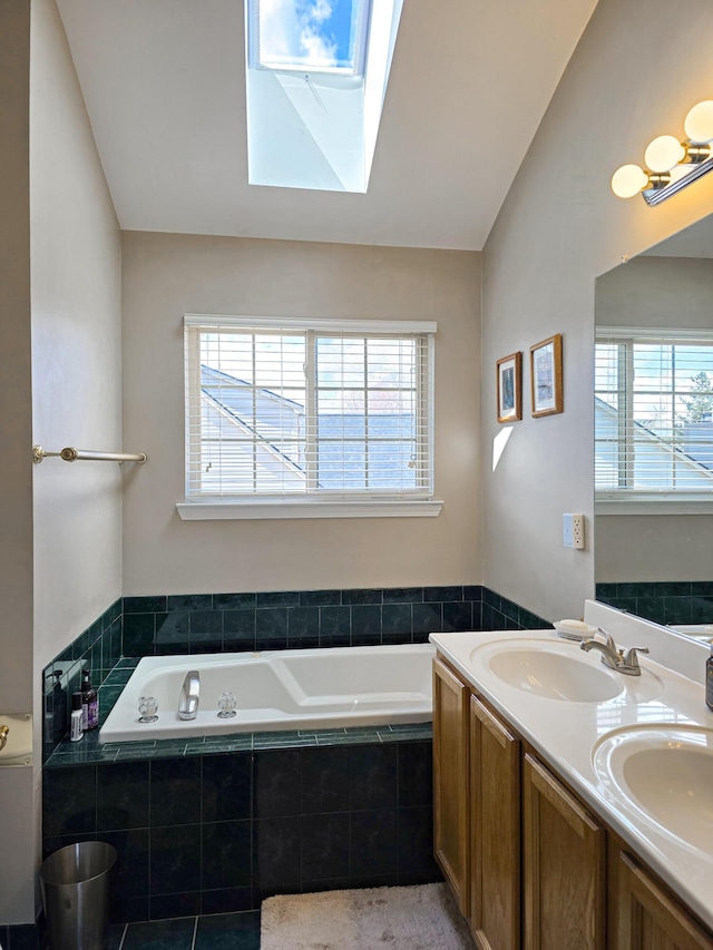 5795 Versailles Ave, Ann Arbor, MI 48103 - bathroom with a healthy amount of sunlight, a skylight, and a sink