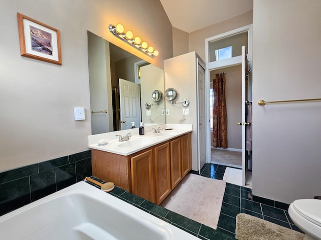 5795 Versailles Ave, Ann Arbor, MI 48103 - bathroom featuring double vanity, tile patterned floors, toilet, and a sink