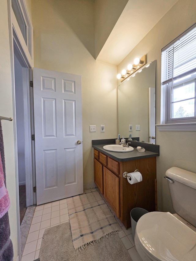 5795 Versailles Ave, Ann Arbor, MI 48103 - bathroom featuring tile patterned flooring, toilet, and vanity