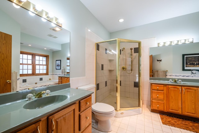 4569 Terra Ln, Saint Joseph, MI 49085 - full bath with tile patterned flooring, vanity, a stall shower, toilet, and a bath