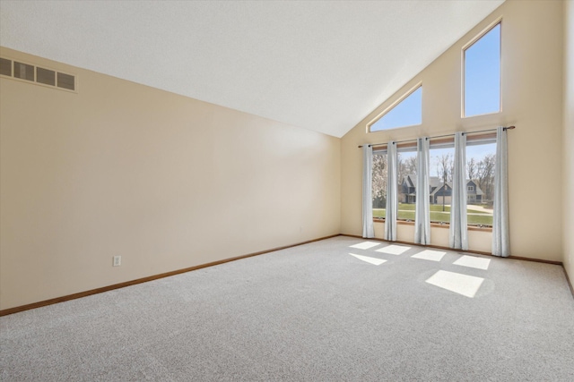 6030 Paw Paw Lake Rd, Coloma, MI 49038 - carpeted empty room with baseboards, visible vents, and high vaulted ceiling