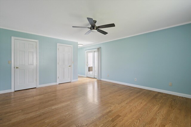 6030 Paw Paw Lake Rd, Coloma, MI 49038 - unfurnished bedroom with ceiling fan, wood finished floors, baseboards, and ornamental molding
