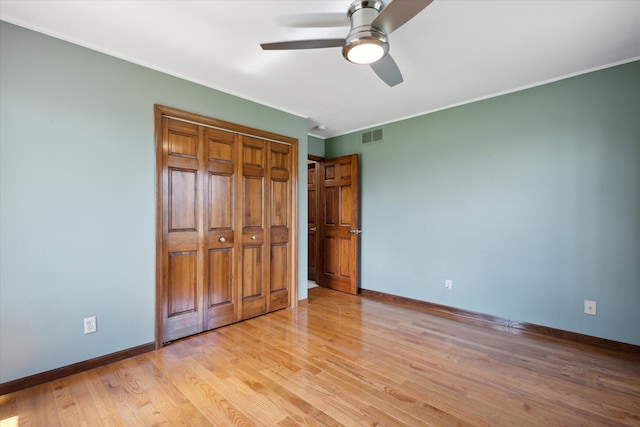 6030 Paw Paw Lake Rd, Coloma, MI 49038 - unfurnished bedroom featuring light wood-type flooring, visible vents, baseboards, and ornamental molding