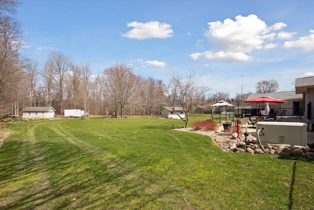 6030 Paw Paw Lake Rd, Coloma, MI 49038 - view of yard featuring a storage unit, a gazebo, and an outbuilding