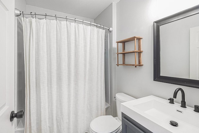 bathroom featuring shower / tub combo with curtain, vanity, and toilet