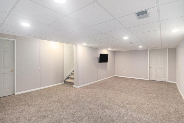finished below grade area with stairway, recessed lighting, visible vents, and carpet