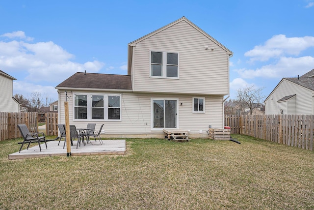 rear view of property featuring a patio area, a lawn, and a fenced backyard