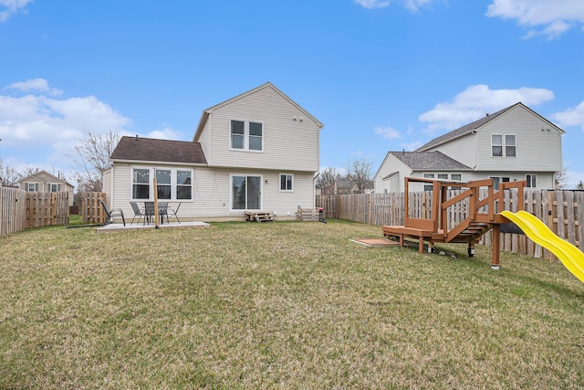 back of property with a lawn, a patio, a fenced backyard, and a playground