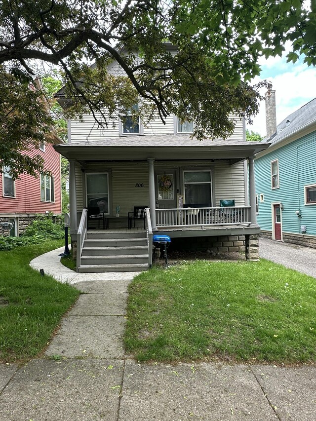 806 Wheaton Ave, Kalamazoo, MI 49008 - view of front of home featuring covered porch and a front yard