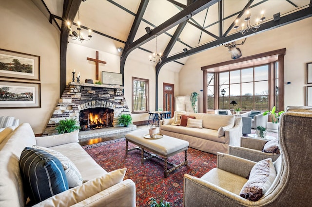living room featuring wood finished floors, a fireplace, a chandelier, and high vaulted ceiling