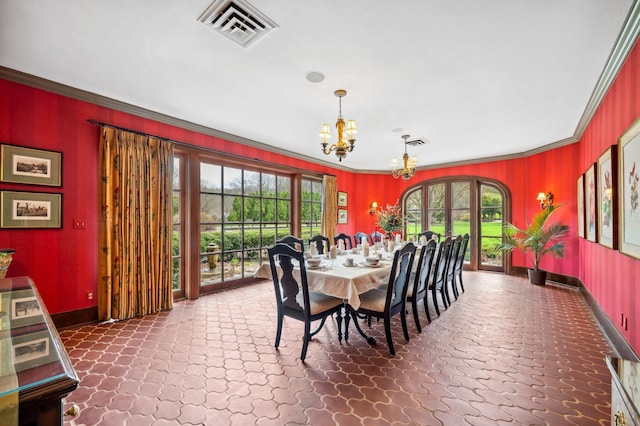 dining space featuring a chandelier, visible vents, and crown molding