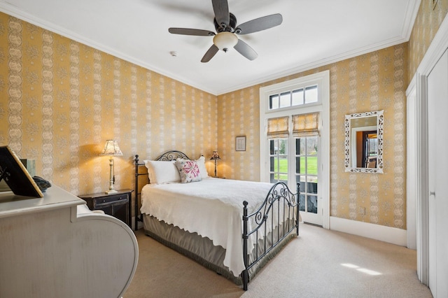 carpeted bedroom with wallpapered walls, access to exterior, crown molding, and a ceiling fan