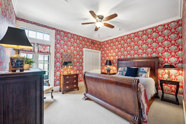 bedroom featuring wallpapered walls, light carpet, ornamental molding, and ceiling fan