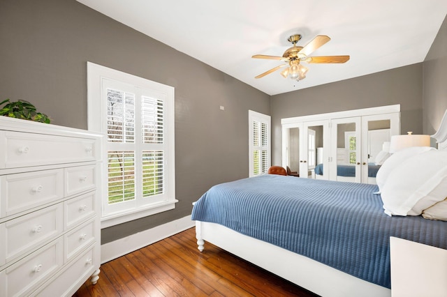 bedroom featuring dark wood-style floors, access to outside, and ceiling fan