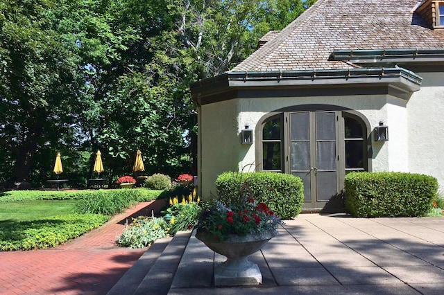 exterior space with a patio, french doors, and stucco siding