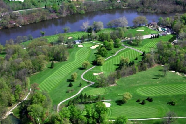 bird's eye view with a water view and golf course view