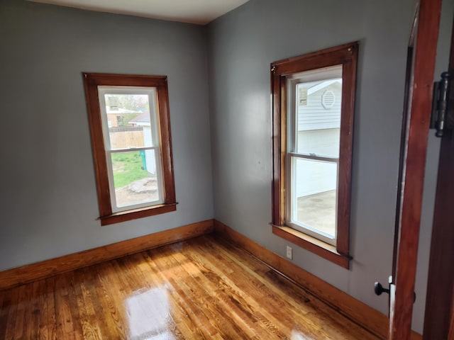 36707 Goddard Rd, Romulus, MI 48174 - unfurnished room featuring baseboards and light wood-type flooring