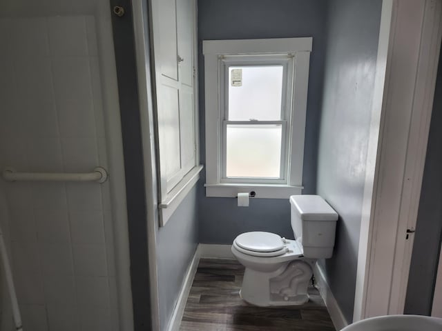 36707 Goddard Rd, Romulus, MI 48174 - bathroom featuring toilet, baseboards, and wood finished floors