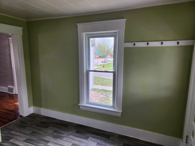 36707 Goddard Rd, Romulus, MI 48174 - interior space featuring baseboards, ornamental molding, wood finished floors, and visible vents