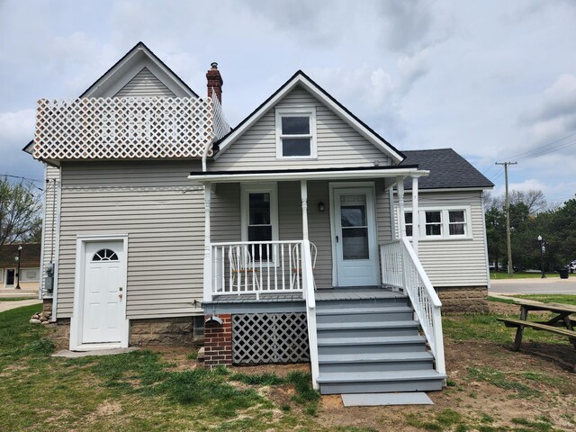 36707 Goddard Rd, Romulus, MI 48174 - view of front of house featuring covered porch and a chimney