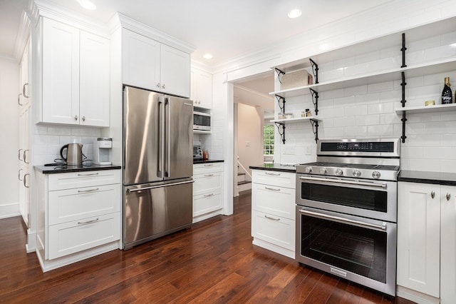 kitchen featuring tasteful backsplash, dark countertops, appliances with stainless steel finishes, open shelves, and ornamental molding