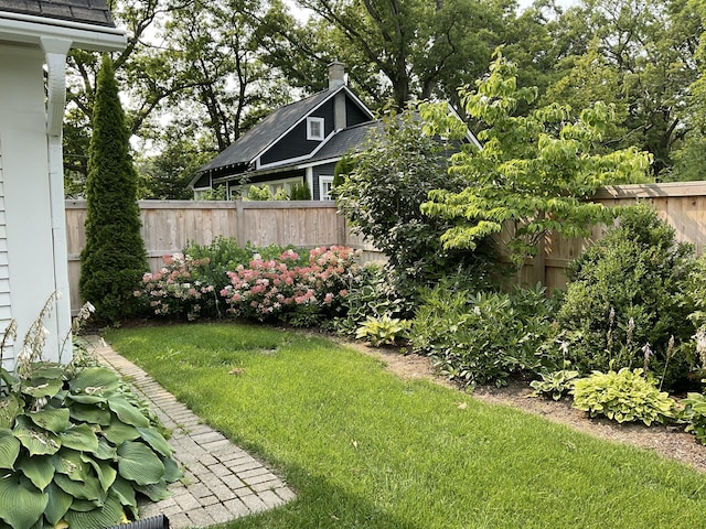 view of yard with a fenced backyard