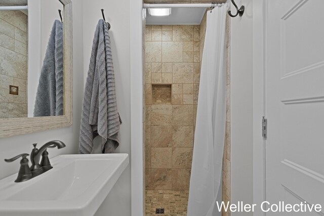 9090 E 32nd Rd, Cadillac, MI 49601 - bathroom featuring a sink and a shower stall