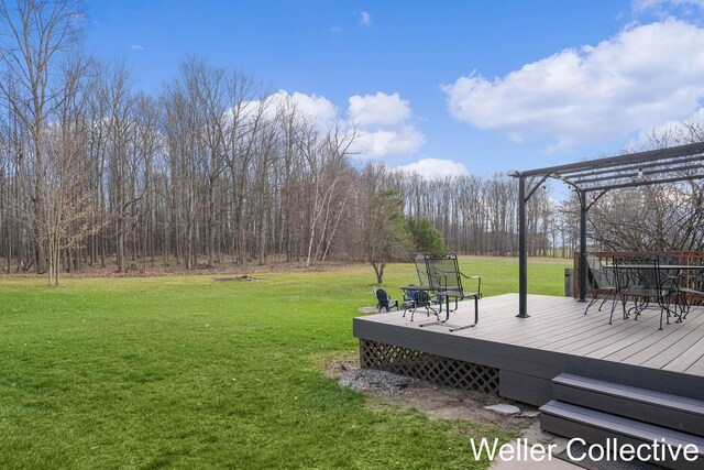 9090 E 32nd Rd, Cadillac, MI 49601 - view of yard with a pergola and a deck