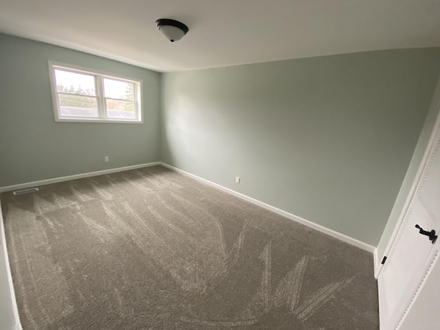 10 Meadow Hills Ln, Fremont, MI 49412 - carpeted spare room with visible vents and baseboards
