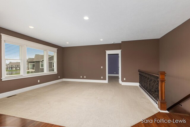 6501 Andres Xing Unit 14, Grandville, MI 49418 - spare room with recessed lighting, wood finished floors, visible vents, and baseboards