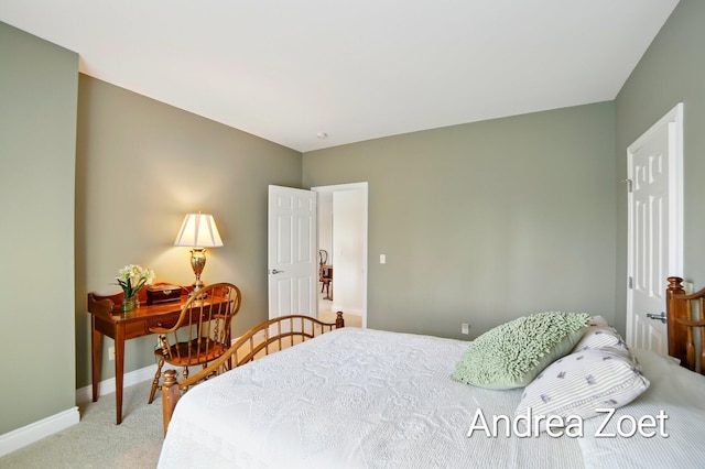 bedroom featuring light colored carpet and baseboards
