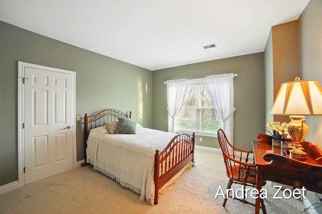carpeted bedroom featuring visible vents and baseboards
