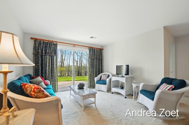 sitting room with carpet flooring and visible vents