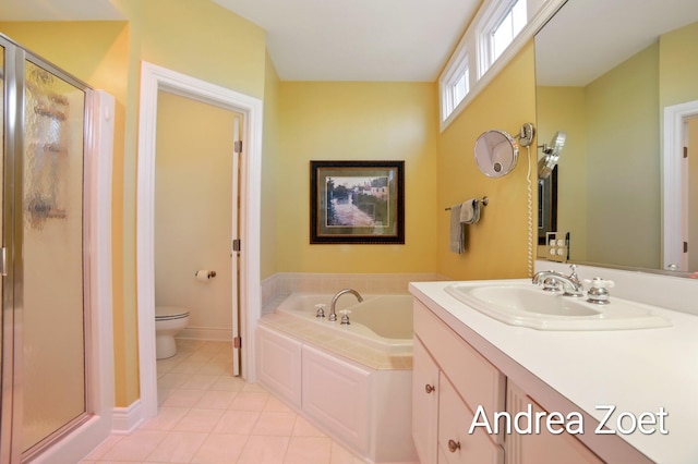 full bath with tile patterned floors, toilet, a bath, vanity, and a stall shower