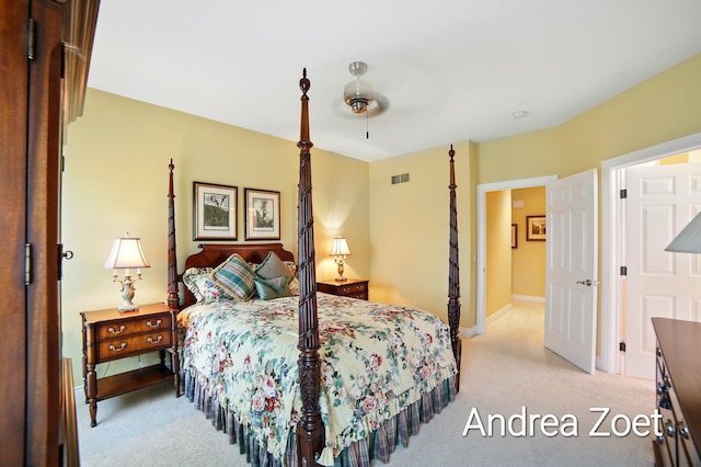 bedroom with baseboards, visible vents, a ceiling fan, and light colored carpet
