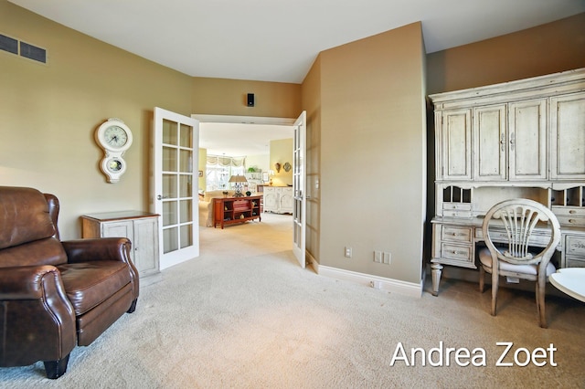 sitting room featuring visible vents, french doors, carpet flooring, and baseboards