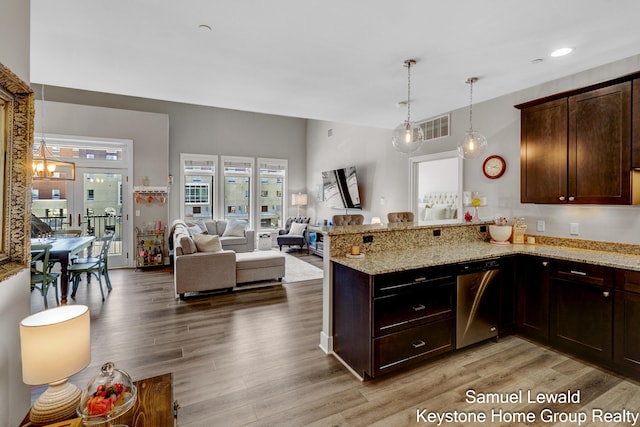 430 Union Ave NE Unit 303, Grand Rapids, MI 49503 - kitchen featuring light wood-type flooring, a peninsula, dishwasher, and visible vents