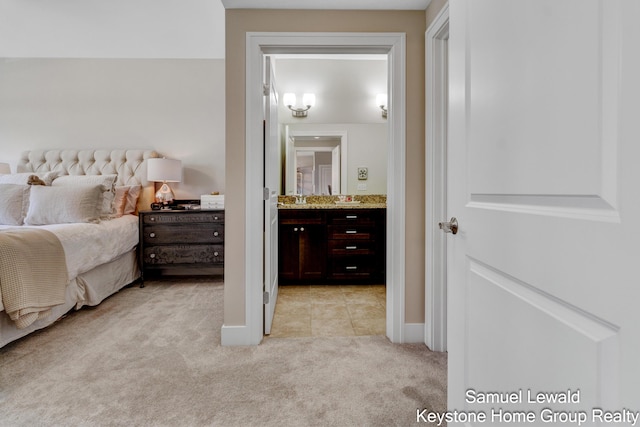 430 Union Ave NE Unit 303, Grand Rapids, MI 49503 - bedroom featuring light colored carpet, baseboards, and ensuite bathroom