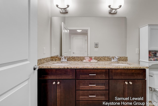 430 Union Ave NE Unit 303, Grand Rapids, MI 49503 - bathroom with double vanity, toilet, and a sink