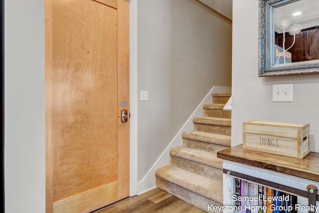 430 Union Ave NE Unit 303, Grand Rapids, MI 49503 - foyer entrance with baseboards, wood finished floors, recessed lighting, and stairs