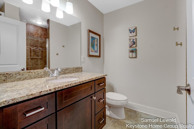430 Union Ave NE Unit 303, Grand Rapids, MI 49503 - full bathroom with tile patterned floors, baseboards, vanity, and toilet