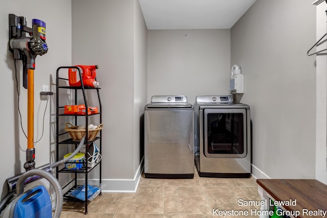 430 Union Ave NE Unit 303, Grand Rapids, MI 49503 - laundry room with washing machine and dryer, baseboards, and laundry area