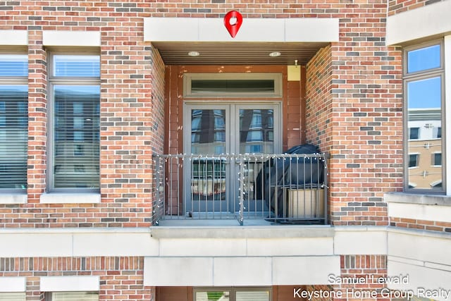 430 Union Ave NE Unit 303, Grand Rapids, MI 49503 - property entrance featuring brick siding