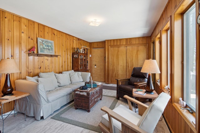 living room with wood walls