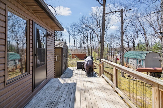 deck with an outdoor structure and a shed