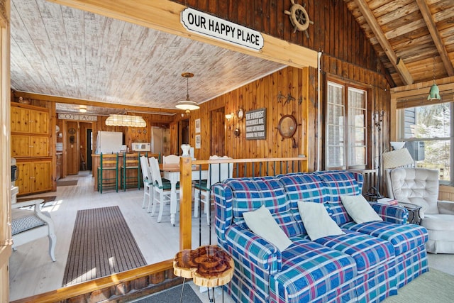 living area featuring wood ceiling, lofted ceiling, wood finished floors, and wooden walls