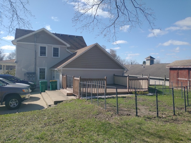 101 N Lewis St, Saline, MI 48176 - rear view of property featuring a lawn and fence